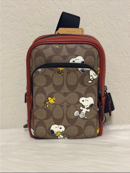 Coach Handbags - Coach X Peanuts Track Pack 14 In Signature Canvas With Snoopy Woodstock